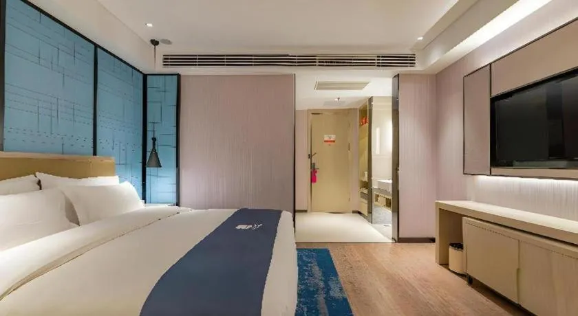 Bed in Echarm Hotel Tai'an Taishan Tianwai Village Hongmen