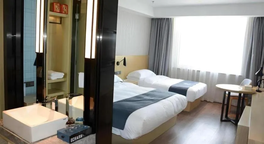 Bed in Echarm Hotel Tai'an Taishan Tianwai Village Hongmen