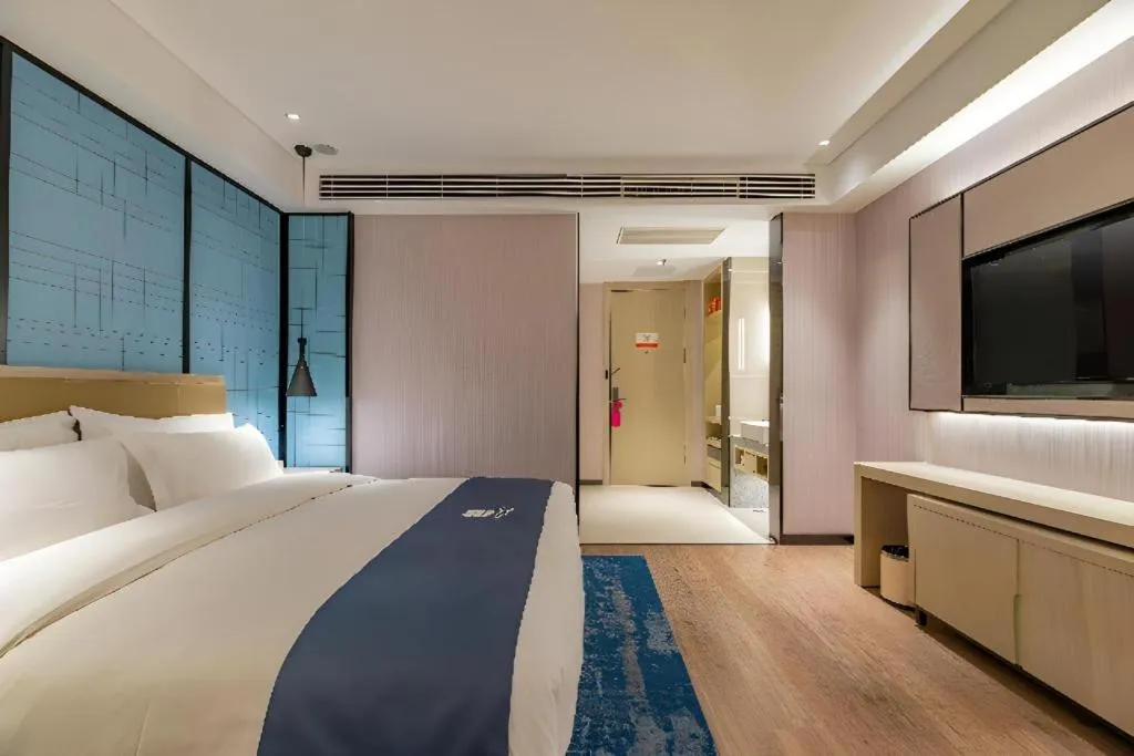 Bed in Echarm Hotel Tai'an Taishan Tianwai Village Hongmen