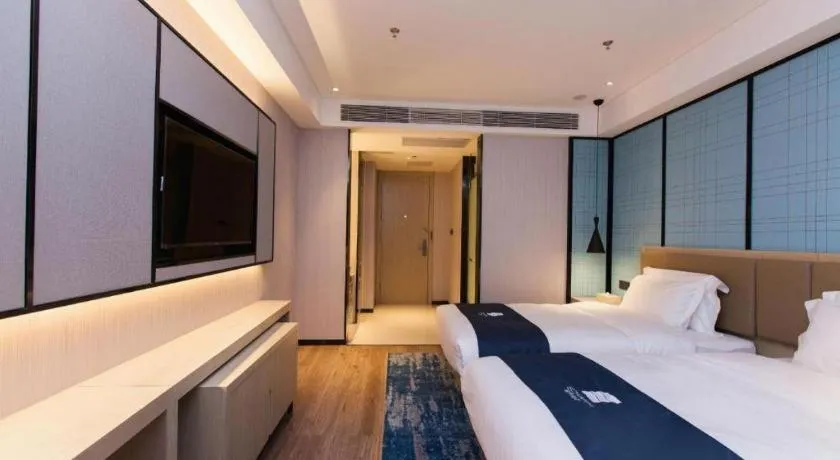 Bed in Echarm Hotel Tai'an Taishan Tianwai Village Hongmen