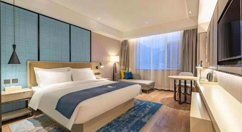 Bed in Echarm Hotel Tai'an Taishan Tianwai Village Hongmen