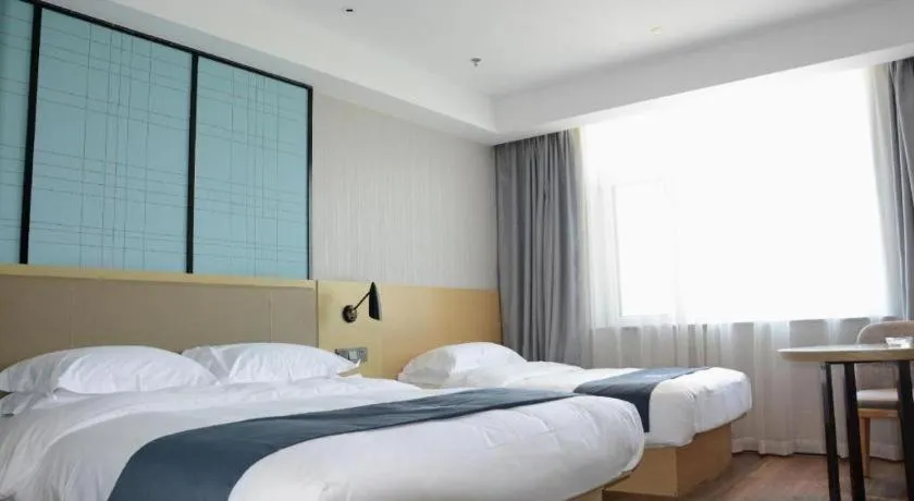 Bed in Echarm Hotel Tai'an Taishan Tianwai Village Hongmen