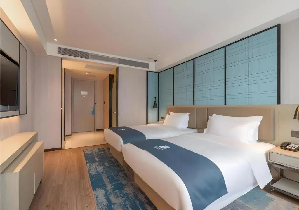 Bed in Echarm Hotel Tai'an Taishan Tianwai Village Hongmen