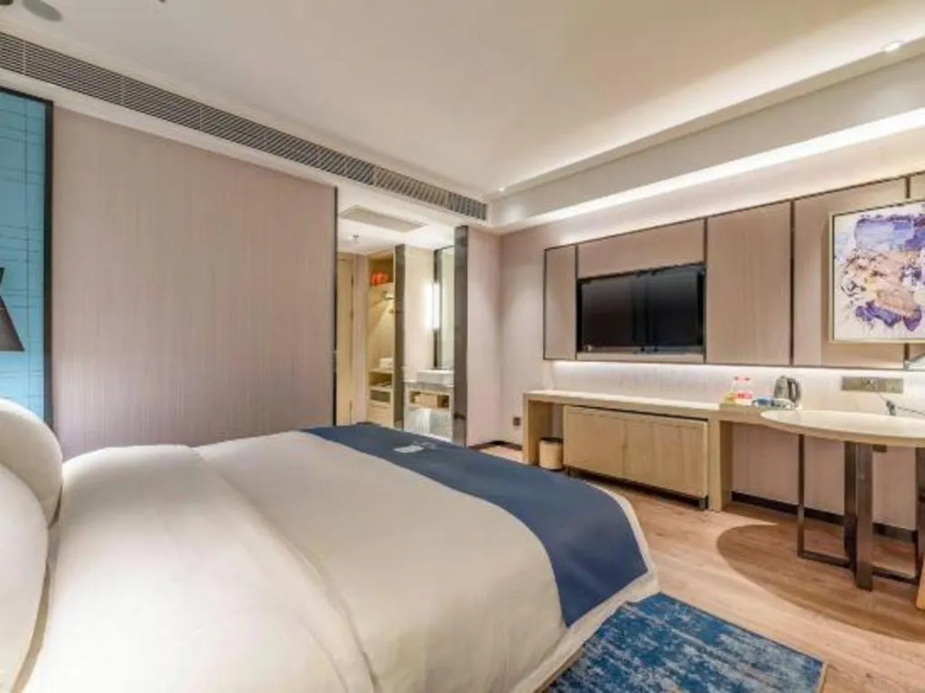 Bed in Echarm Hotel Tai'an Taishan Tianwai Village Hongmen