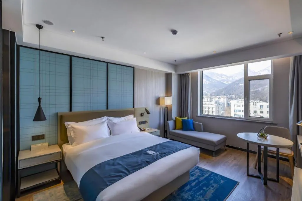 Bed in Echarm Hotel Tai'an Taishan Tianwai Village Hongmen