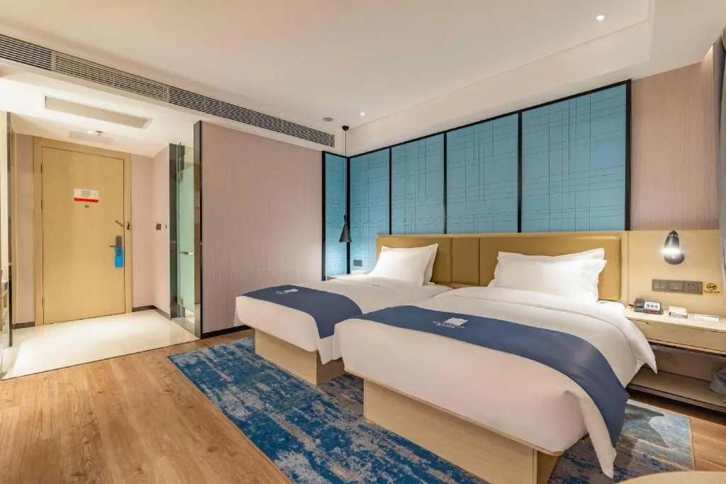 Bed in Echarm Hotel Tai'an Taishan Tianwai Village Hongmen