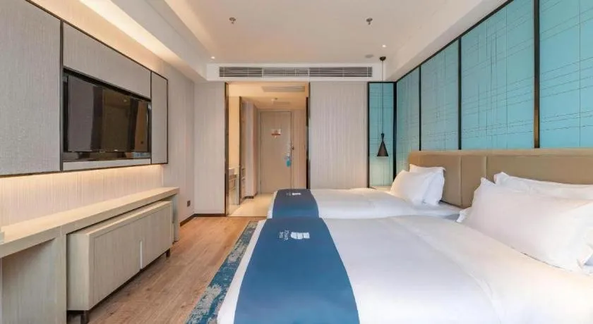 Bed in Echarm Hotel Tai'an Taishan Tianwai Village Hongmen