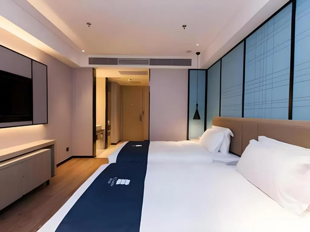 Bed in Echarm Hotel Tai'an Taishan Tianwai Village Hongmen