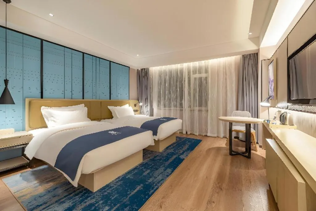 Bed in Echarm Hotel Tai'an Taishan Tianwai Village Hongmen