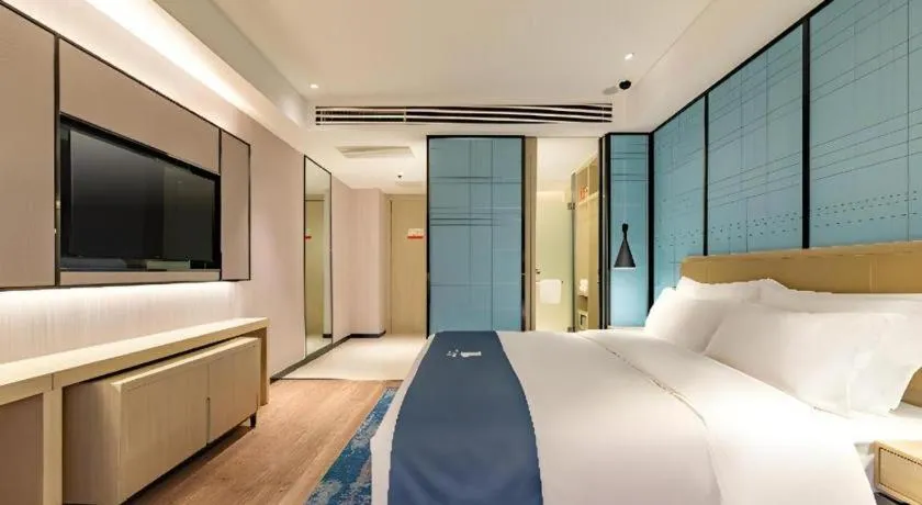 Bed in Echarm Hotel Tai'an Taishan Tianwai Village Hongmen