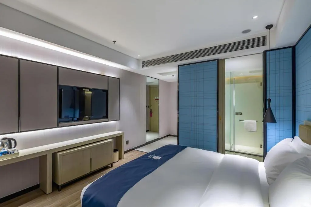 Bed in Echarm Hotel Tai'an Taishan Tianwai Village Hongmen