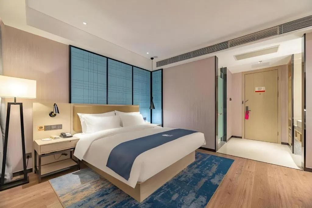 Bed in Echarm Hotel Tai'an Taishan Tianwai Village Hongmen