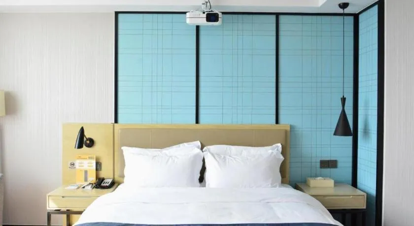 Bed in Echarm Hotel Tai'an Taishan Tianwai Village Hongmen