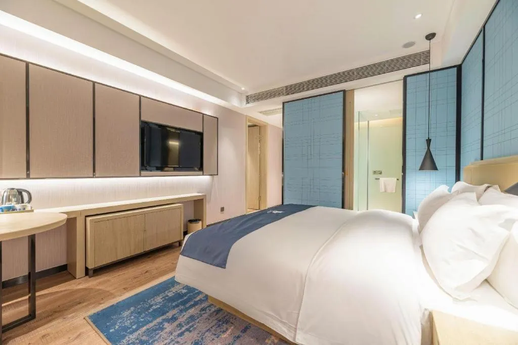 Bed in Echarm Hotel Tai'an Taishan Tianwai Village Hongmen