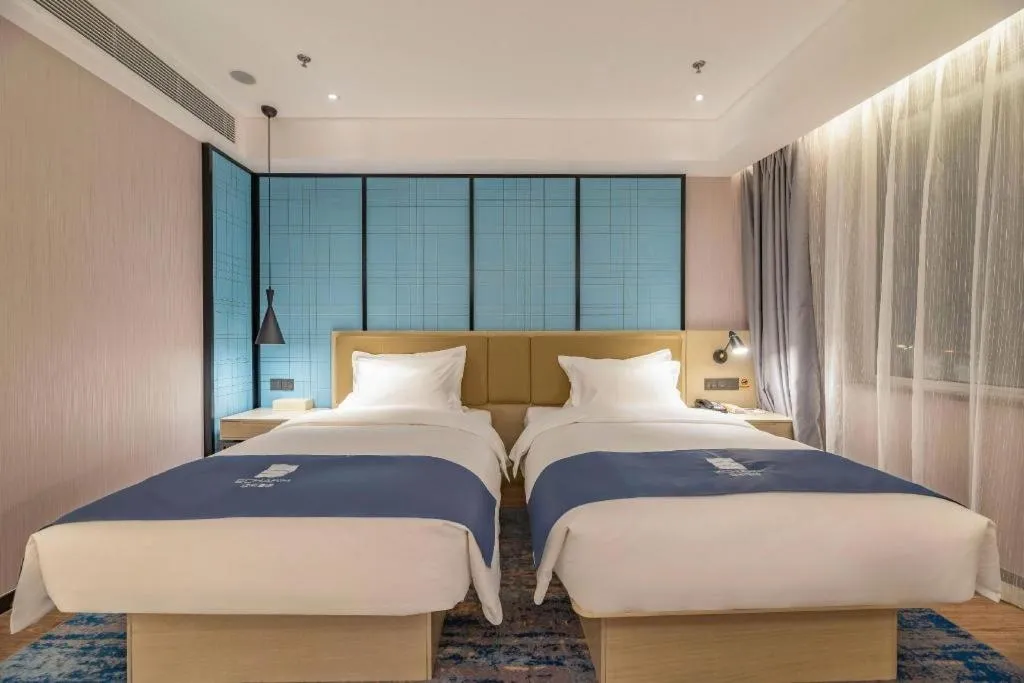 Bed in Echarm Hotel Tai'an Taishan Tianwai Village Hongmen