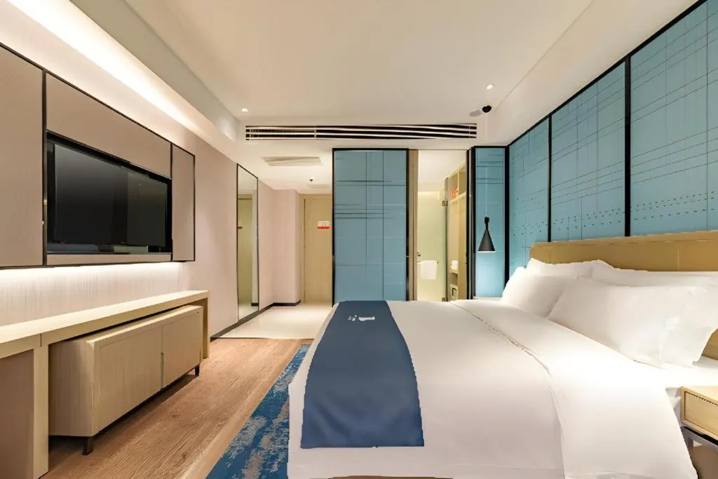 Bed in Echarm Hotel Tai'an Taishan Tianwai Village Hongmen