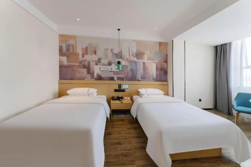 Bed in City Comfort Inn Fuchuan Fenghuang Road