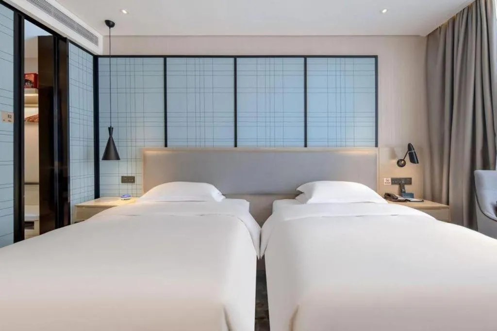 Bed in Echarm Hotel Nanning Dongge Macun Metro Station