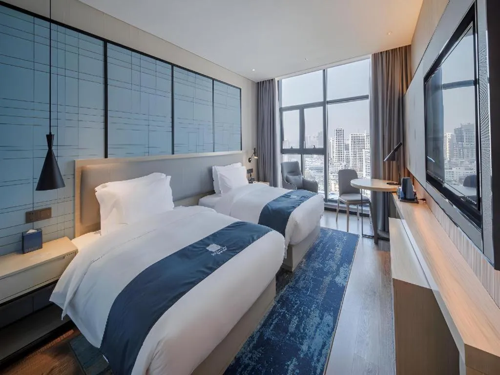 Bed in Echarm Hotel Nanning Dongge Macun Metro Station