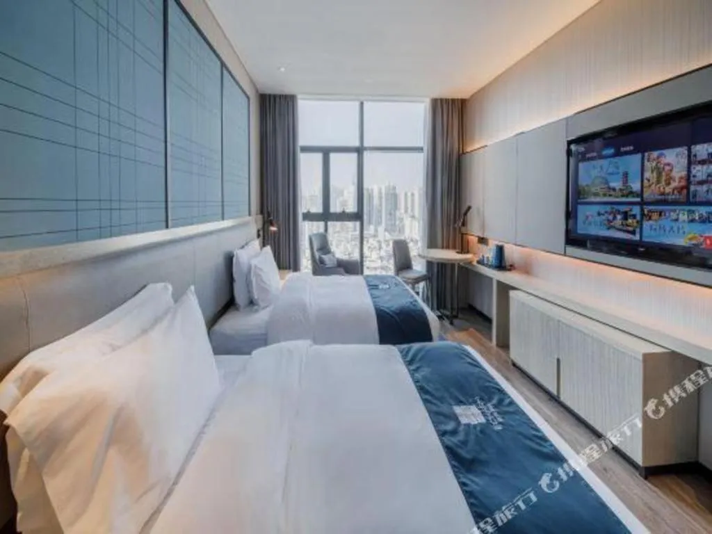 Bed in Echarm Hotel Nanning Dongge Macun Metro Station