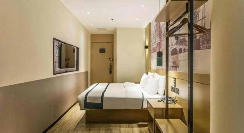 Bed in City Comfort Inn Wuzhou High-speed Railway Station Canghai Lake Park