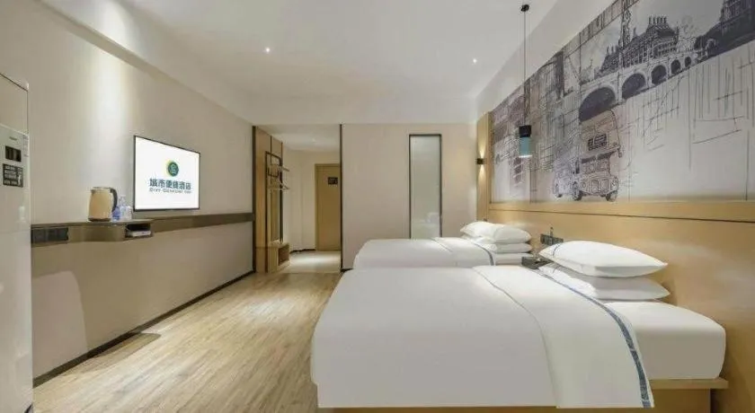 Bed in City Comfort Inn Wuzhou High-speed Railway Station Canghai Lake Park