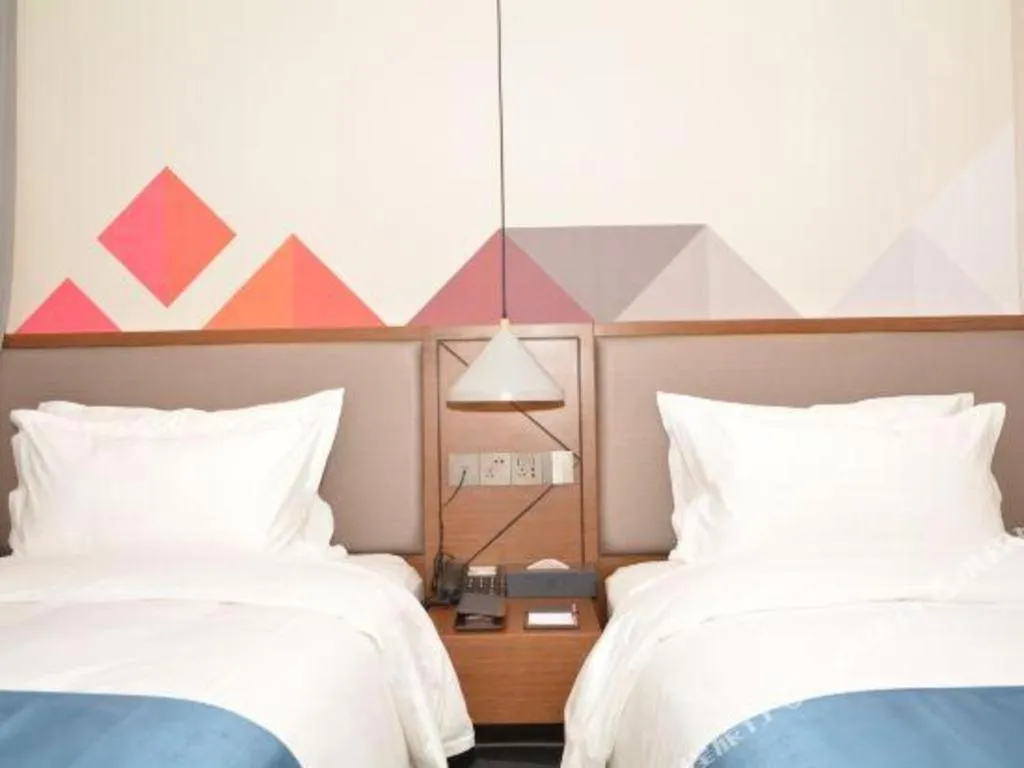 Bed in Borrman Hotel Ji'nan Aoti Center East Provincial Hospital