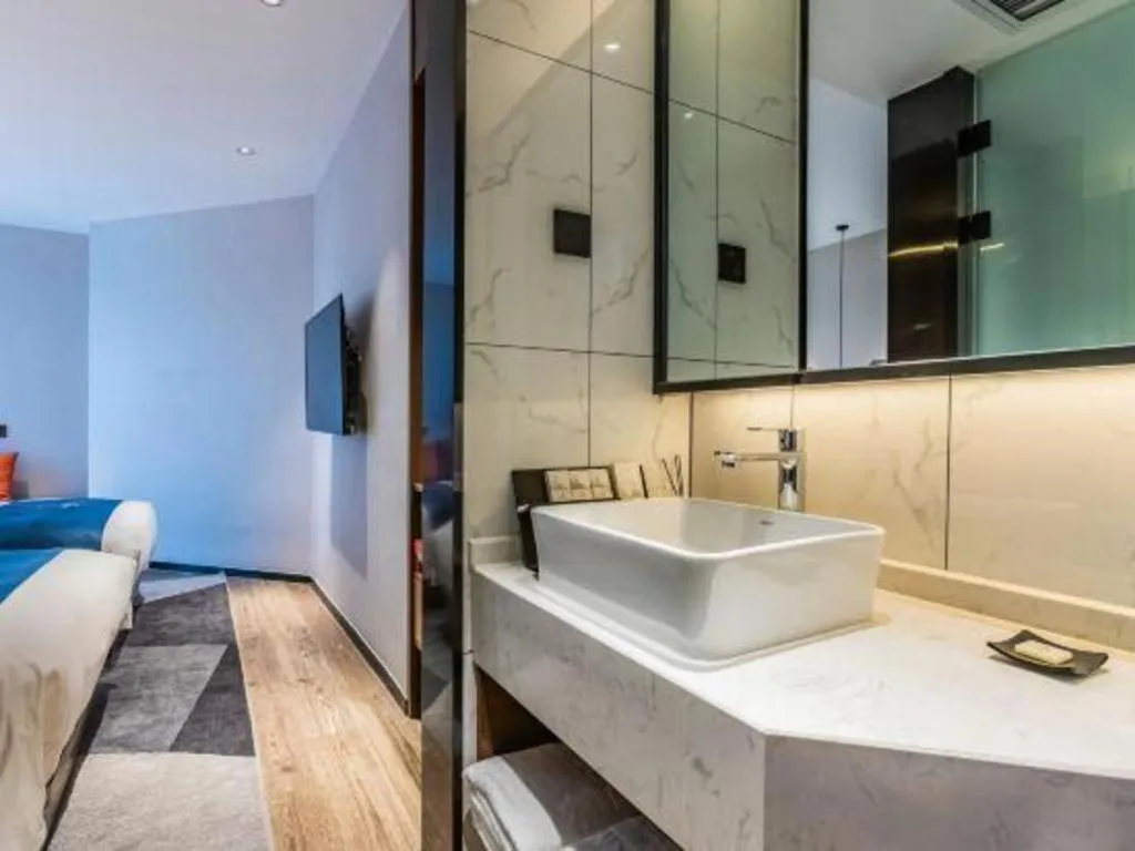 Bed in Borrman Hotel Ji'nan Aoti Center East Provincial Hospital