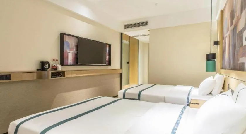 Bed in City Comfort Inn Liuzhou Liucheng