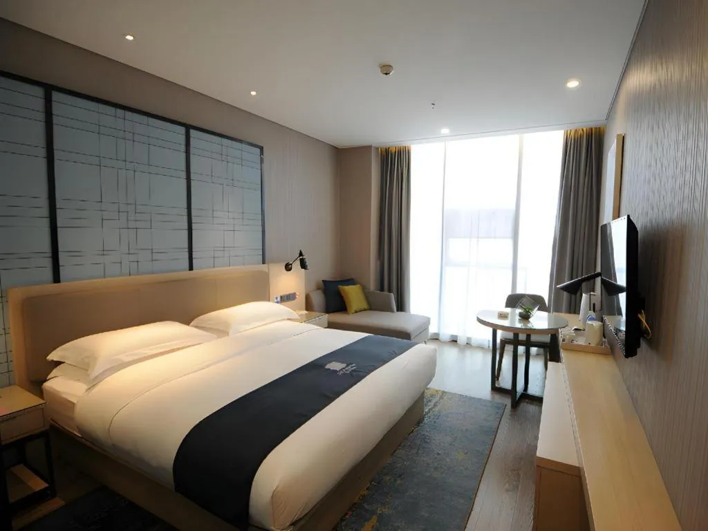 Bed in Echarm Hotel Kunming High-speed Railway South Station Chunrong Street Metro Station