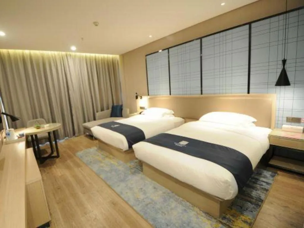 Bed in Echarm Hotel Kunming High-speed Railway South Station Chunrong Street Metro Station