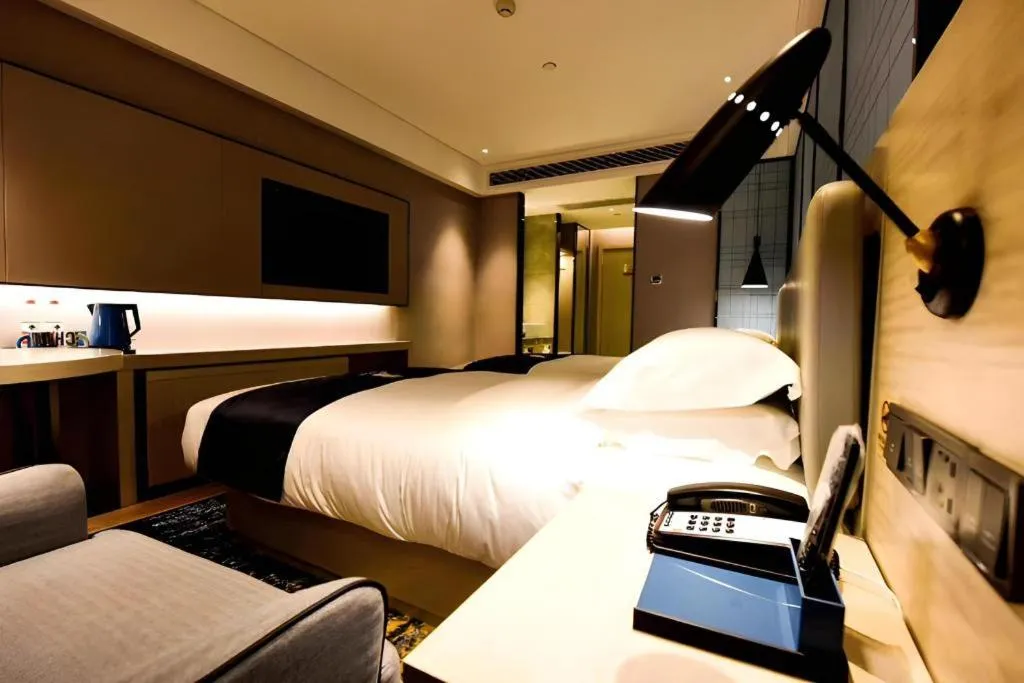 Bed in Echarm Hotel Kunming High-speed Railway South Station Chunrong Street Metro Station