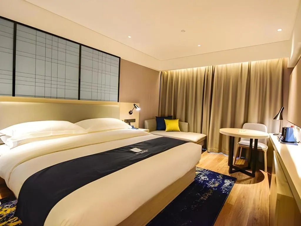 Bed in Echarm Hotel Kunming High-speed Railway South Station Chunrong Street Metro Station