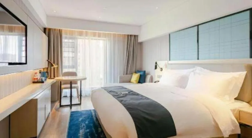 Bed in Echarm Hotel Kunming High-speed Railway South Station Chunrong Street Metro Station