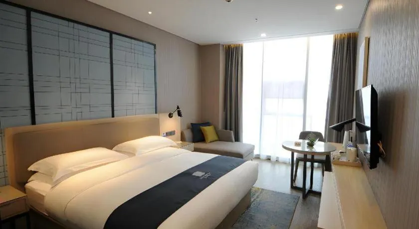 Bed in Echarm Hotel Kunming High-speed Railway South Station Chunrong Street Metro Station