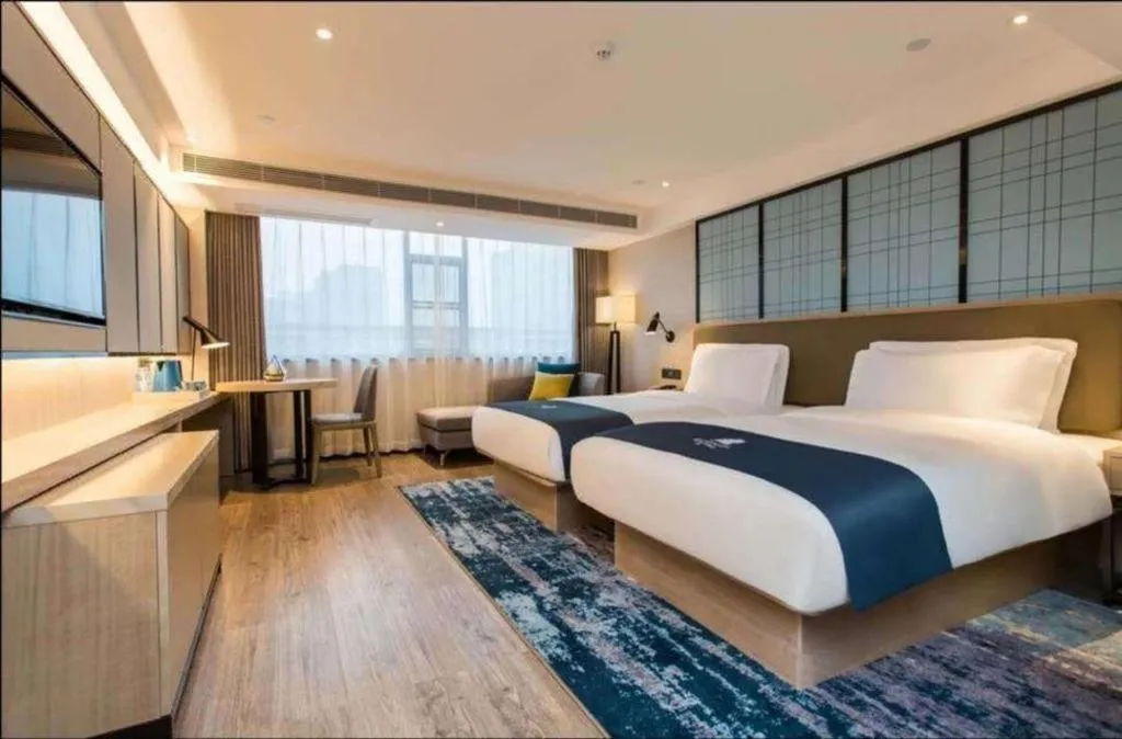 Bed in Echarm Hotel Kunming High-speed Railway South Station Chunrong Street Metro Station