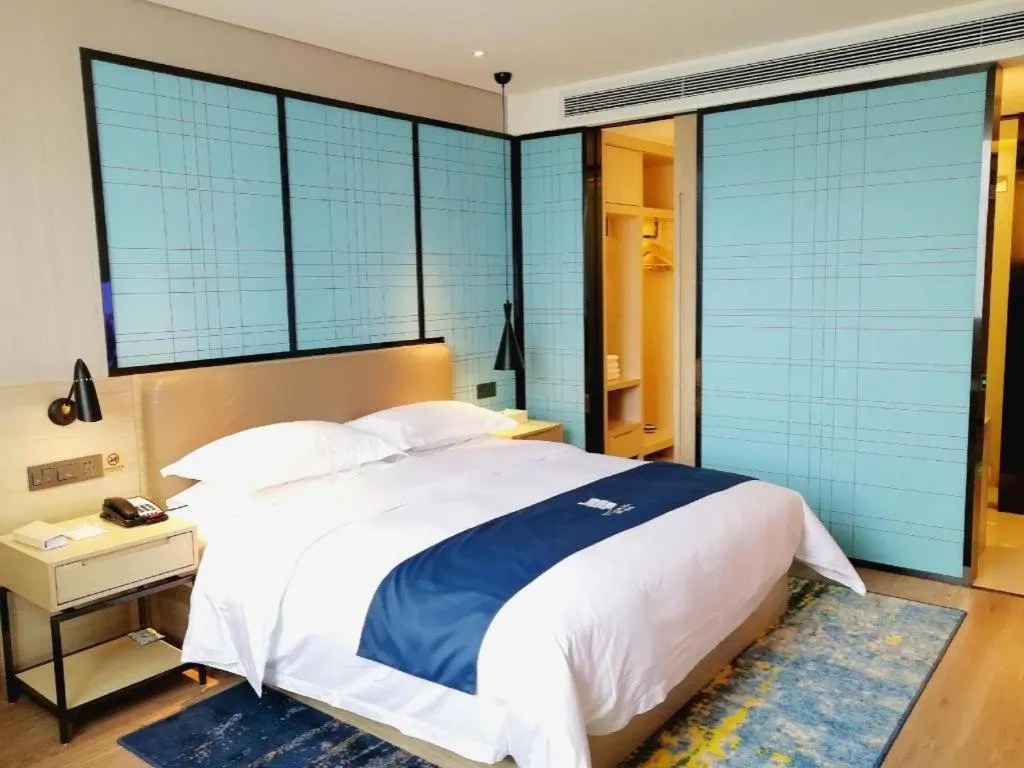 Bed in Echarm Hotel Kunming High-speed Railway South Station Chunrong Street Metro Station