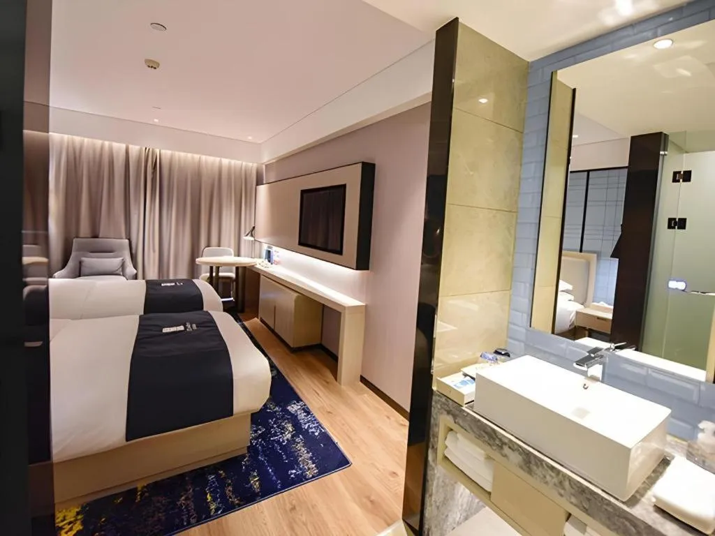 Bed in Echarm Hotel Kunming High-speed Railway South Station Chunrong Street Metro Station