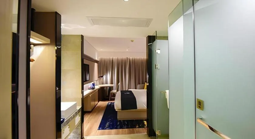 Bed in Echarm Hotel Kunming High-speed Railway South Station Chunrong Street Metro Station