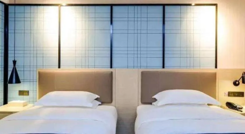 Bed in Echarm Hotel Kunming High-speed Railway South Station Chunrong Street Metro Station