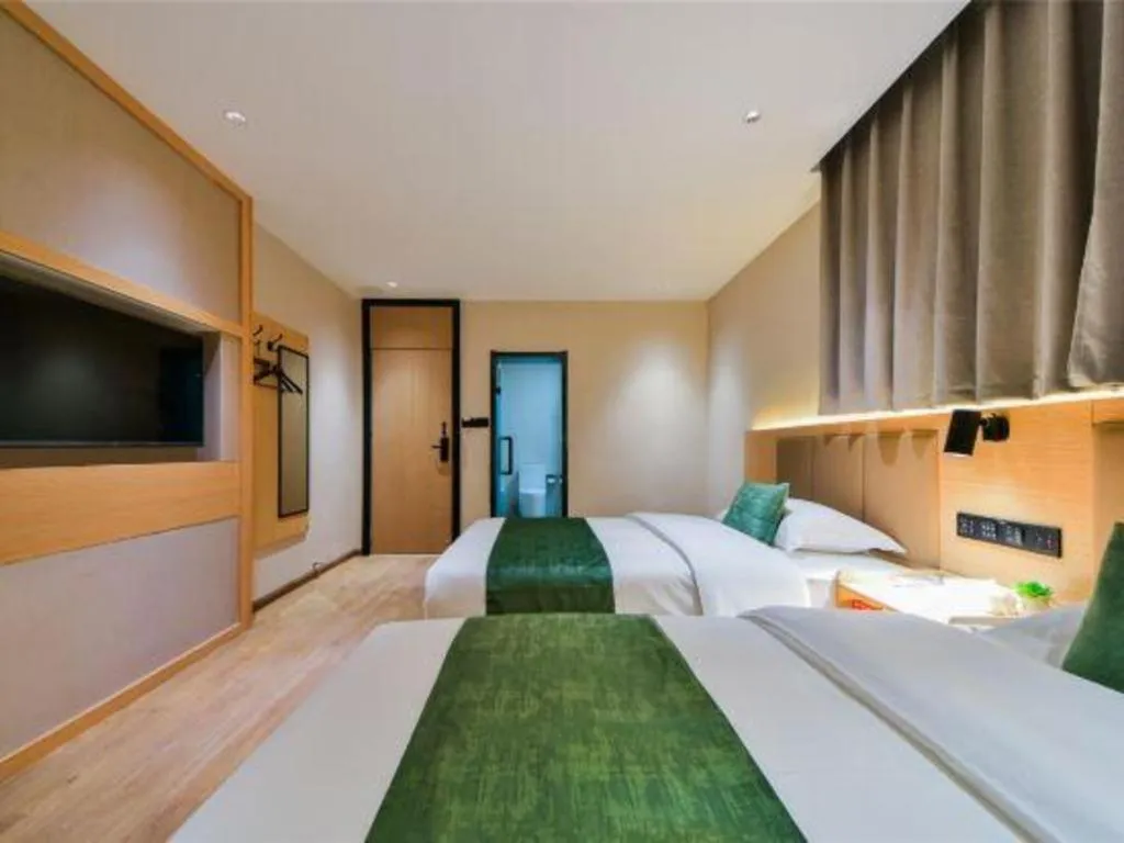 Bed in Echarm Hotel Kunming High-speed Railway South Station Chunrong Street Metro Station