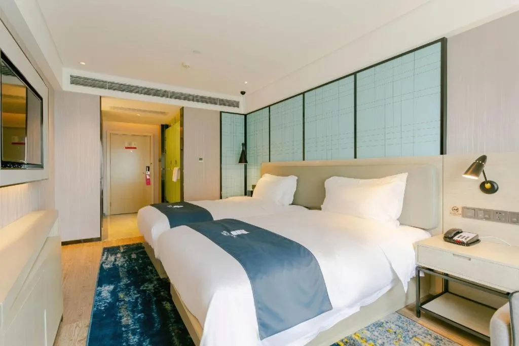 Bed in Echarm Hotel Kunming High-speed Railway South Station Chunrong Street Metro Station