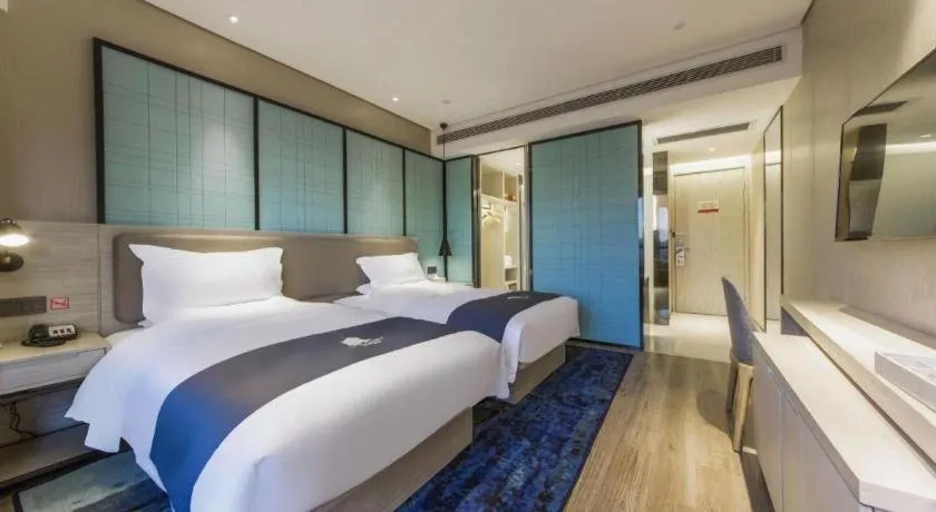 Bed in Echarm Hotel Kunming High-speed Railway South Station Chunrong Street Metro Station