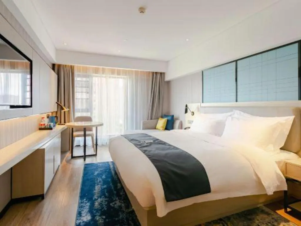 Bed in Echarm Hotel Kunming High-speed Railway South Station Chunrong Street Metro Station