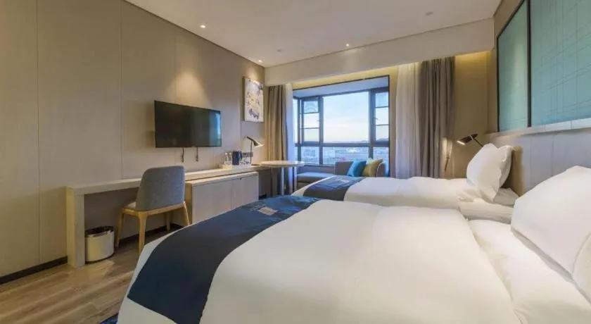 Bed in Echarm Hotel Kunming High-speed Railway South Station Chunrong Street Metro Station