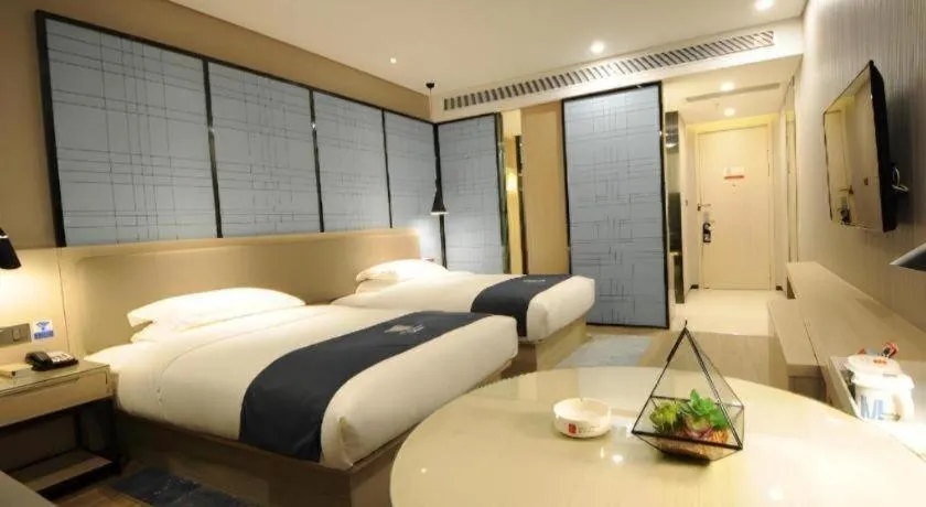 Bed in Echarm Hotel Kunming High-speed Railway South Station Chunrong Street Metro Station