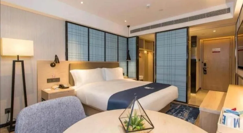 Bed in Echarm Hotel Kunming High-speed Railway South Station Chunrong Street Metro Station