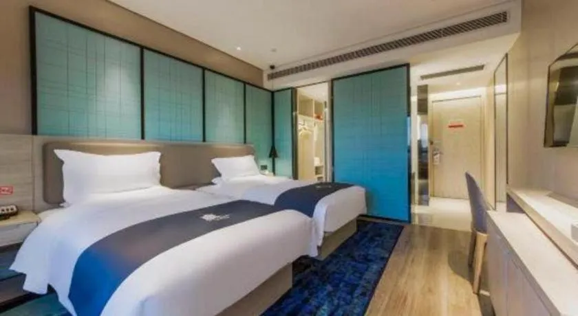 Bed in Echarm Hotel Kunming High-speed Railway South Station Chunrong Street Metro Station