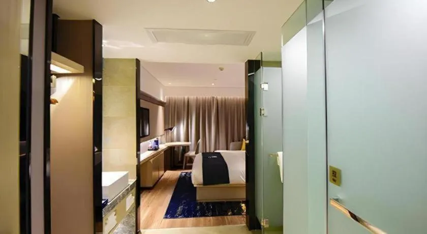 Bed in Echarm Hotel Kunming High-speed Railway South Station Chunrong Street Metro Station