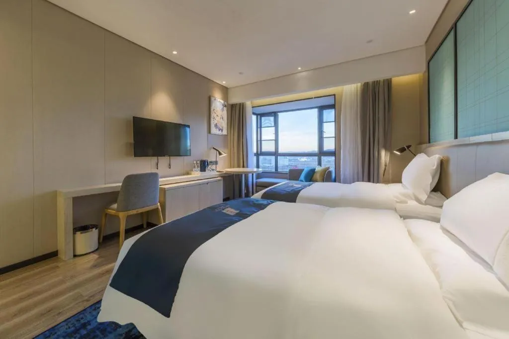 Bed in Echarm Hotel Kunming High-speed Railway South Station Chunrong Street Metro Station